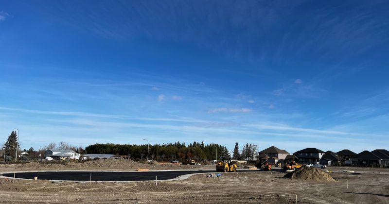 Shot of construction site with some houses in the background